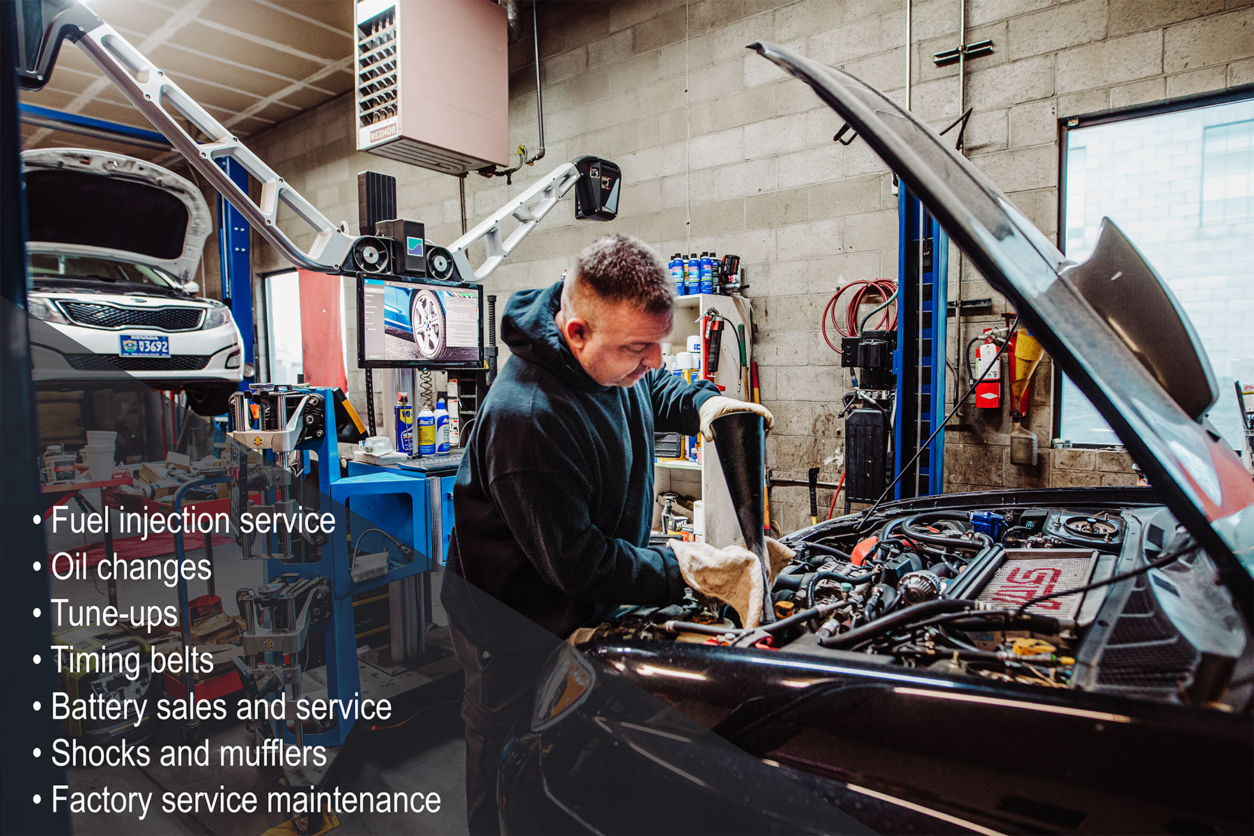 List of services as a man repairs a car in the background